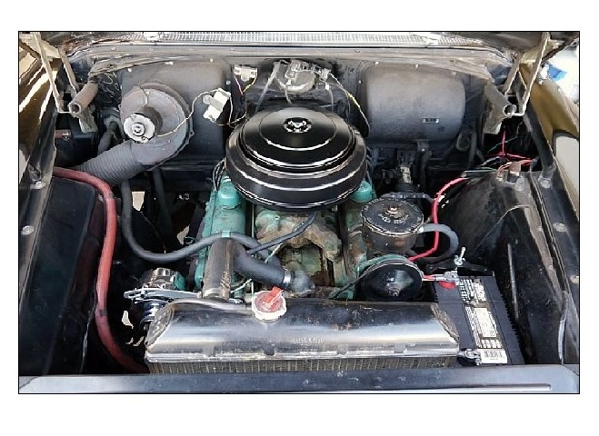 Here we have a photo of the Buick's engine happily at home in
				a very well detailed engine bay.