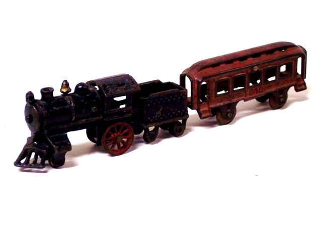 Pictured is a 2-4 locomotive missing a pair of the middle wheels. There also is a matching tender and a nice red passenger car.