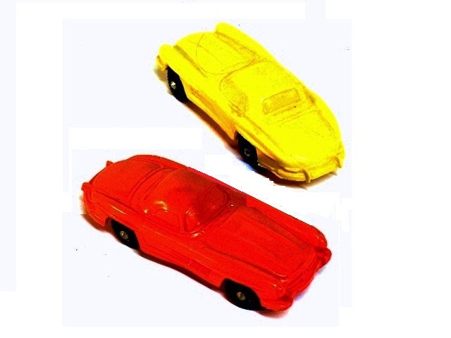 at top here is a yellow Tomte Laerdahl Mercedes 300SL, and below it a red Volvo P1800, both with black wheels, 4 inches long.