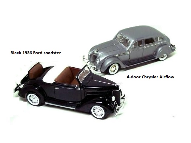 A black 1936 Ford roadster, brown leather upholstery both inside and the rumble seat, and chrome wheel covers with wide white sidewalls. Behind the Ford is a silver, 4-door Chrysler Airflow.