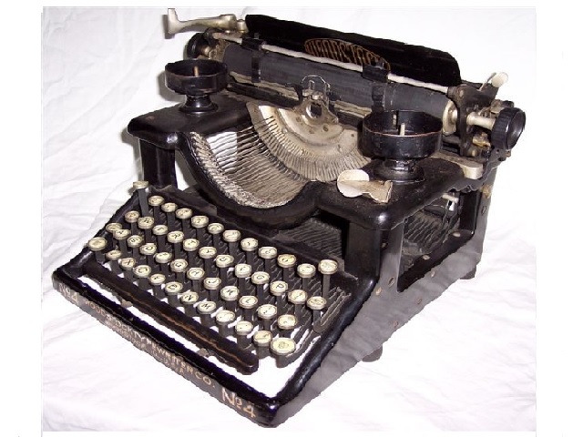 When the Emerson Typewriter Company (see the Emerson in the collection) closed its doors, the Woodstock was born. It was quite successful under the management by Sears-Roebuck, which had taken ownership. Alvah Roebuck, president of the company, designed a totally new and different typewriter to replace the Emerson, and it was very successful from its inception in 1919 up through and beyond the Depression. Though there is but one photo of the Mellow 60s Museum's Woodstock, many more will be added.
