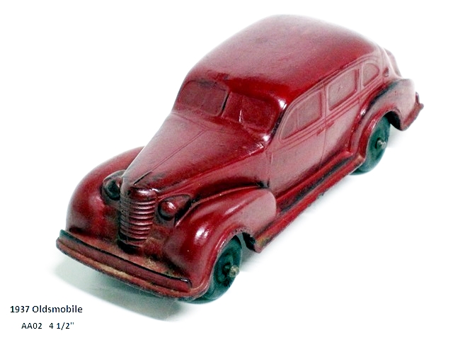A dark red 1937 Oldsmobile 4-door viewed from the upper left front quarter. The car has suicide doors, black wheels and is 4 1/2 inches long.