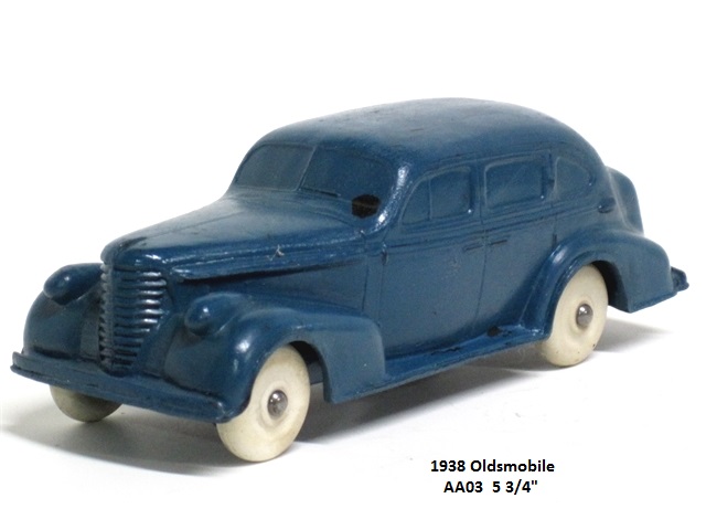 A lovely blue 1938 Oldsmobile 4-door sedan seen from the right front quarter. The car has suicide doors, white wheels and is 5 3/4 inches long.