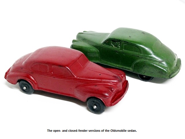 A pair of '40 Olds sedans, one red with open fenders and one green with closed.