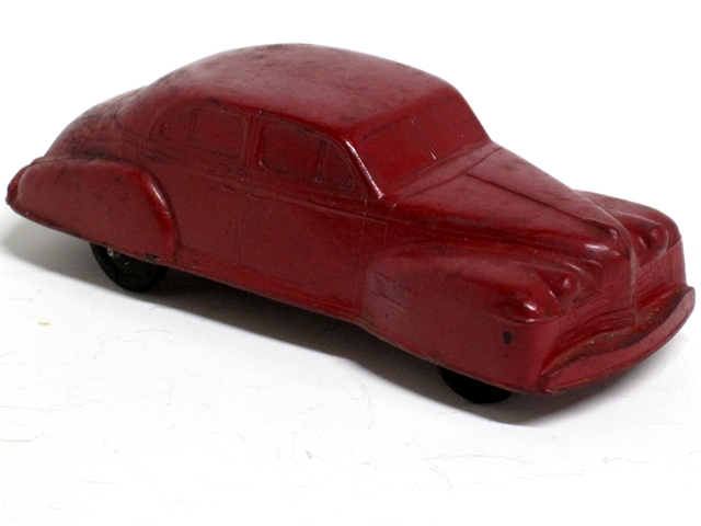 Another red '40 Olds with black tires and closed fenders.