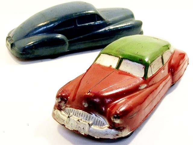 A sleek green over red 1948 fastback Buick two-door sedanette. The Buick is 7 1/4 inches long.