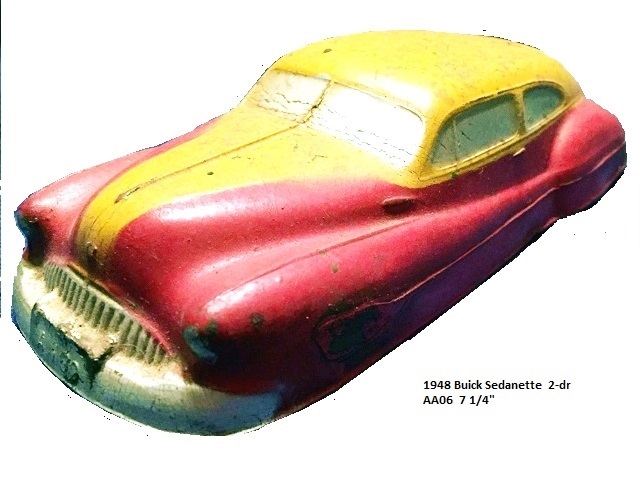 A stunning yellow over red Buick fastback two-door, seen along the driver's side front quarter.