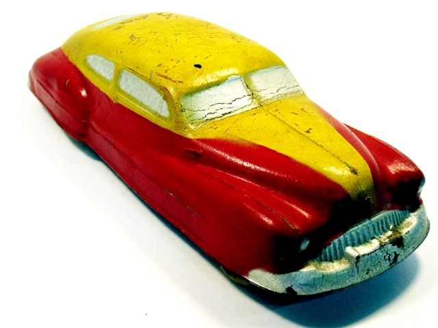 Another view of the yellow and red Buick seen along the passenger side front quarter.