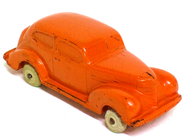 Here we have the '39 Plymouth in orange, from the passenter side front quarter.