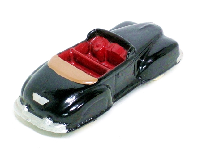 A a custom painted green 1946 Lincoln with green interior and square headlights. Four and one half inches long.