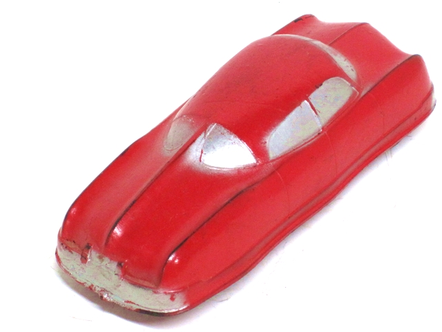 A rear quarter view of the red sedan.