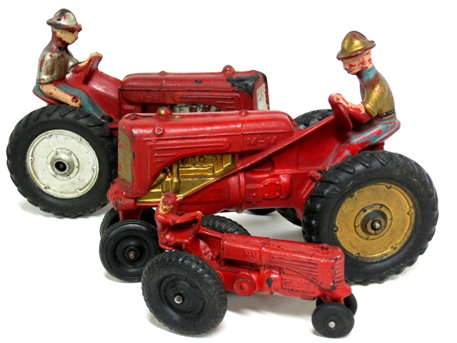 Three variations of the Minneapolis Moline tractors, one red four inch and 2 red eight inch