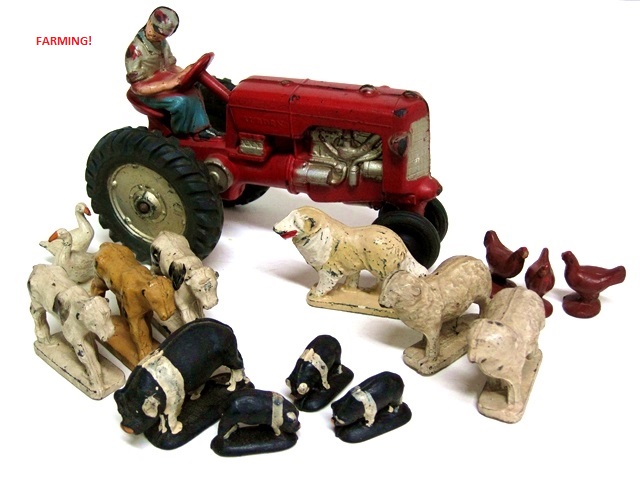 This photo is of a large red tractor with farm animals.
