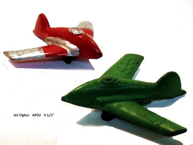 Left and right front quarter view of a red and a green swept wing jet fighter, 4 1/2 inches long. It has silver silver trim on the wings and vertical stabilizer. From the factory, they had no horizontal stabilizers.