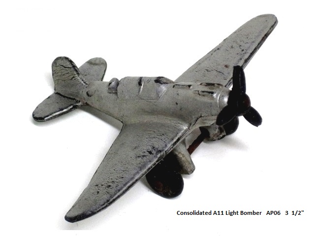 A silver Consolidated A-11 light bomber, 3 1/2 inches long.