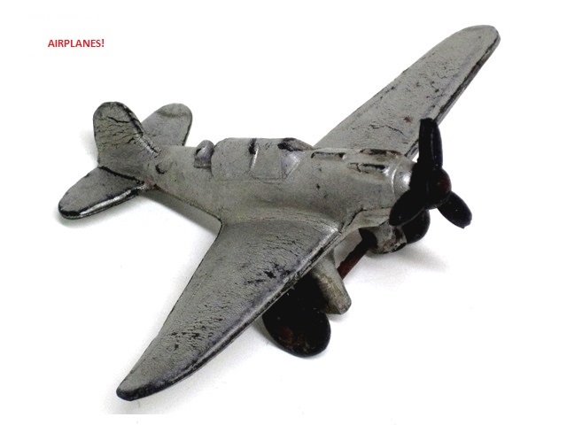 A silver dive bomber with open rear cockpit.