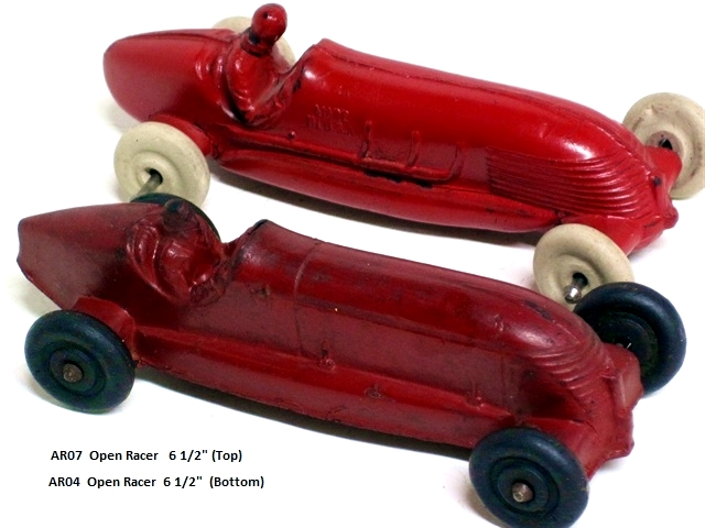 Two smaller racers, the AR05 and AR07, made by Auburn are seen here. One is deep red with black wheels, the other bright red with white wheels. The dark red racer has exhaust on the left with two hood hinges on the lest. One the bright red car has exhaust on the right. One has a more rounded rear than the other. The grill on the dark red version is smaller than the other, which is longer and more swept back. The drivers' cockpits differ, with the dark red being deeper and more rounded at the sides. Both are 4 3/4 inches long. Both also came as 6 1/2 inch versions.