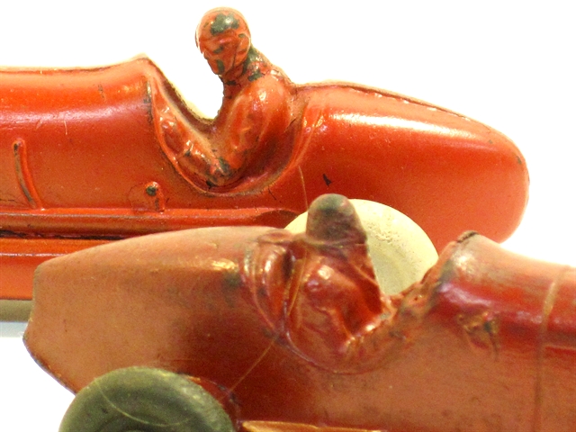 The same racers in a close-up of the differences in the cockpits and the rear body shape (one rounded, one straight.