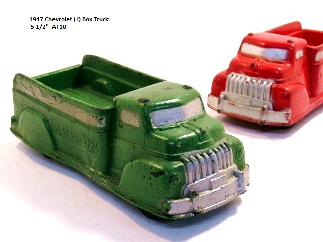 This rough and ready green truck (foreground) is likely a 1947 Chevrolet box truck. The same truck
				in red is shown just behind it.