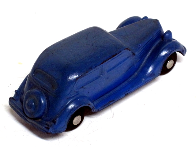 This is the same blue sedan seen from the rear quarter.