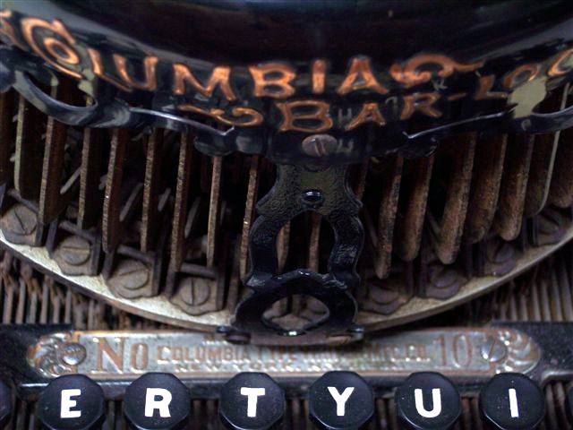 This is a close up view of the top center of the keyboard and the base of the mechanism.
