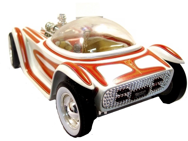 Photo two of the Bandit. Very thin arched fenders with slightly wider runningboards. They run the full lengh of the car, rising in a high arch higher than the front and rear of the body. The Oldsmbile body, hood, trunk and chassis are of one piece and wrap around the cockpit, which is covered by a hemispherical, clear bubble; it tilted forward to gain access. The car is white with dramatic copper graphics, and is steered, powered, and shifted by a chrome floor stick. (The body was formed around a concrete casting. The instrument cluster on the dash is primitive at best but it looks good and no doubt worked. There are splendid, old-school hotrod upholstered bucket seats (two) with high backs. The quad headlights are bullets, interated into and located beneath the fenders. Steel wheels are chromed and sport baby Moon caps. Wide whitewalls dress up the tires, which are larger at the rear of the car than at the front. A 303 c.i. Olds engine, blown and injected, provides the power. Everything blends beautifully into a somewhat of a unibody.