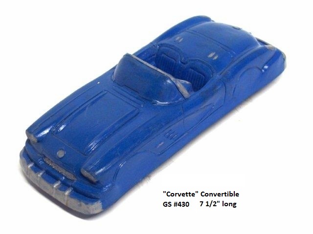 The Corvette roadsters -- this one is blue with lots of silver trim -- are fairly realistic, right down to the badges. These, like all Garrett cars and trucks, have closed fender wells. This shot is taken from the left front quarter.