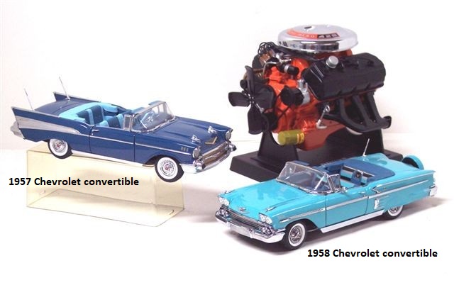 The last photo, for now, is two Chevrolet convertibles and a much larger scale Hemi engine. The autos are a 1957 Chevrolet and a 1958 Chevrolet, both two-doors. The '57 is dark blue with dark blue and almost turquoise interior. The '58 is light blue with blue and black interior. The '57 has twin antennae, the '58 a continental kit. Both cars have wide whitewalls. The 1:6 scale, diecast Hemi engine block is red with black valve covers and exhaust manifolds and a large chrome air cleaner cover. Belts and flywheel turn.