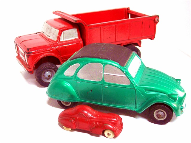 My collection of Duravits is very small, but the toys are so well made that just to have one would have been wonderful. This photo shows my green Citroen 2CV and my bright red dump truck. Pictured with them is a Sun rubber toy, a Supercharged coupe in bright red. The Citroen is nine and a quarter inches long, the dump truck nine inches. The Sun toy is 4 inches long, fairly typical for rubber toys.