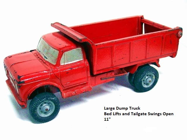 This is the first of 4 photos of my Duravit dump truck, a bright red, heavy duty toy with working dump bed and tailgate. Unfortunately, the person from whom I purchased it just wrapped a sheet of tissue around it, put it into an otherwise empty shoebox, and mailed it. It arrived in very bad shape, but it has mended fairly well, so long as one doesn't look too close. This view is the driver's side. The grill and headlamps are silver, the wheels are gray. The truck has dual rear wheels, is lumpy as a truck should be, and will be a great addition to any kid's building collection.