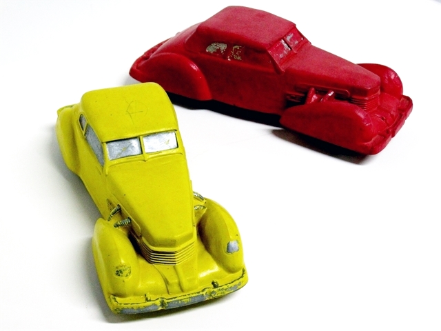 This photo is of two coupes, oe solid red, the other solid yellow. Most of the silver is worn away.