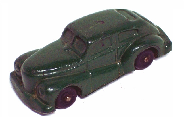This is a rear quarter view along the driver's side. The rear window is set very high and there is a raised area over the trunk which I suppose would be decorative rather than functional in a real car.