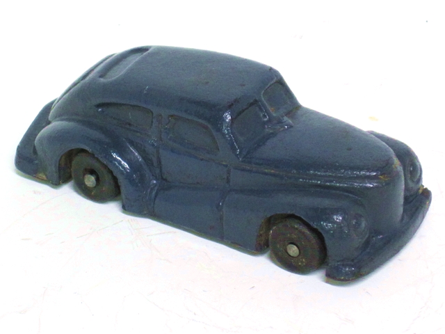 This is a front quarter view of the car in blue.