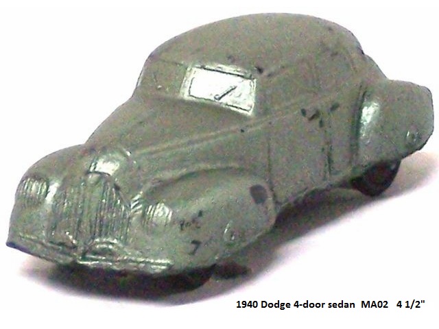 Metallic green Empire version of Sun's 1940 Dodge, viewed from front right quarter. The main difference between the Sun and Empire versions is the grille. The Empire version has a much larger grille with vertical bars. There are vertical lines in the headlights. There are windscreen wipers on the Empire car.