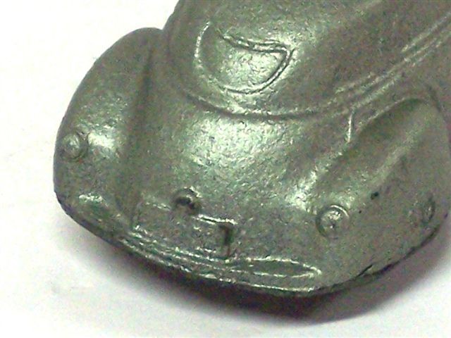 Same car viewed in close up of left rear. Further difference can be seen by looking at the underside of both the Sun and Empire cars. The molds are very different.