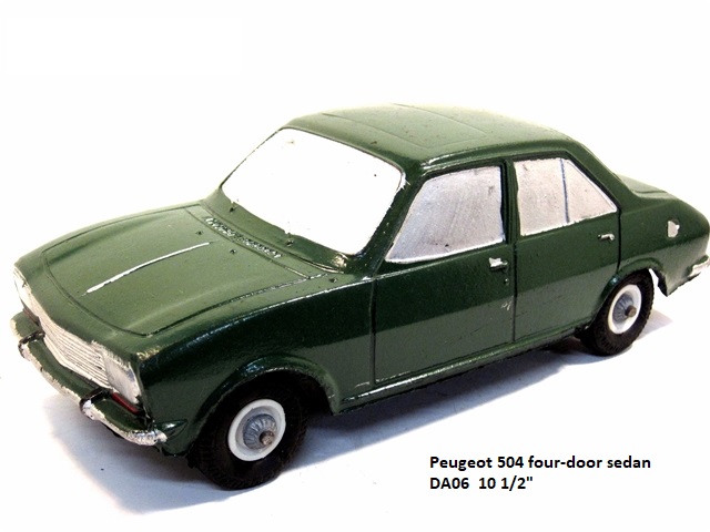 Dark green and very sleek, the Peugeot 504 is compact and simple without being boring or plain. The front fenders and hood slope downward to a wide, chromed grill with rectangular headlights to either side.