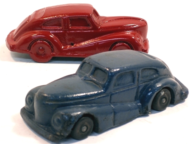 A possible '42 red Nash from an unknown maker and a blue Giftcraft car shown together just because they look so good together! Gift Craft, of Chicago, Illinois was the distributor of this awkward fastback 2-door sedan. Gift Craft was a distributor, but the actual manufacturer is not known. Dave Leopard suggests the car is modeled after the 1946 Nash. When held in the hand, this postwar ugly duckling is as unattractive as the photo shows, but nevertheless it has a charm all its own. With very good original paint it is a nice collector toy. The red sedan is one of the mystery cars in the museum collection. The wheels are cast en bloc with the rest of the car so it does not roll but rather scoots. Dave Leopard suggests this possibly to be a '41 Nash but nothing more about it is known. Each is shown individually under its own page. An interesting aside about the Gift Craft company was that it sold a knock-off OUIJA board called the Swami in 1940 when OUIJA board copies were flooding the marketplace. The Swami featured a flying carpet scene and a genii consulting a crystal ball. I don't know if anybody in Gift Craft management consulted the Swami about the future of the company.