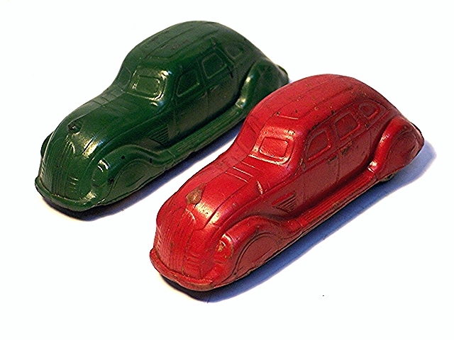 Photo of two Sun supercharged coupes, one green and one red