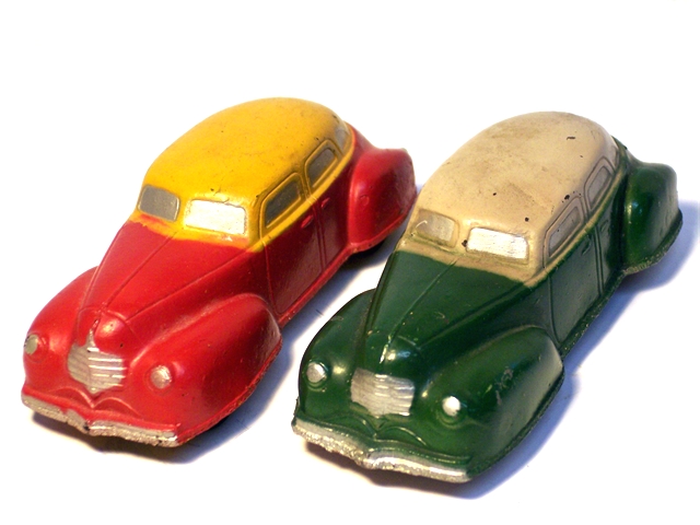 A very nice pair of '40 Dodge autos, one yellow over red, the other white over green.