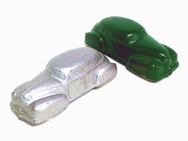 A very nice pair of '40 Dodge autos, one silver, the other green.