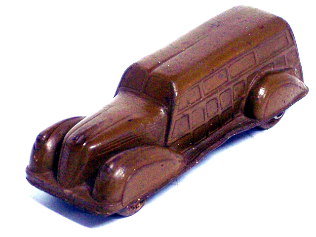 A dark brown 1937 station wagon, viewed from the front quarter.