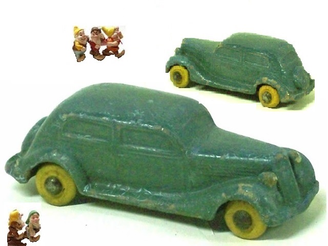 This is the same car noted above, this time with an attempt at the true color. Instead the car is a mottled green with bright yellow tires. In the foreground the car is shown along the passenger side, behind it it is shown along the driver's side. In both photos the Seiberling elves done for Walt Disney admire the sedans.