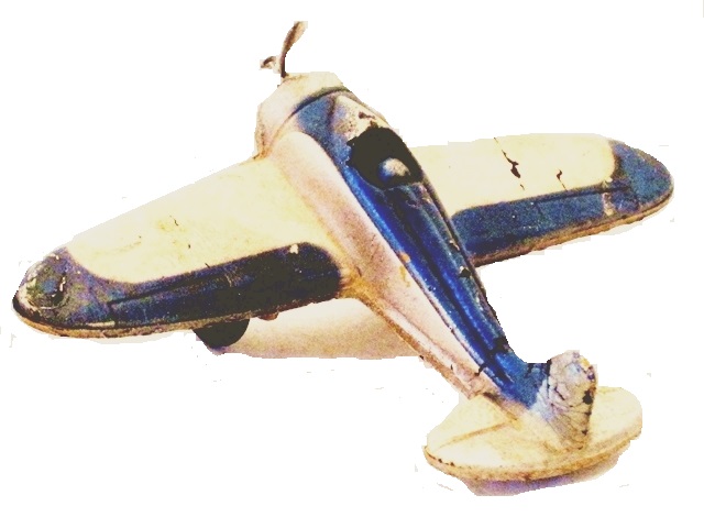 Single seater with white paint and blue striping.This view is of the rear as it would look taking off.