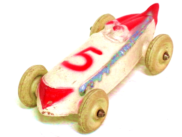 This is a white race car with red trim, the number 5, and large white tires