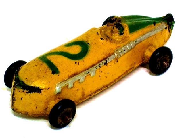 This is a yellow racer with green trim, the number 2, and small black tires. Four and a quarter inches long.