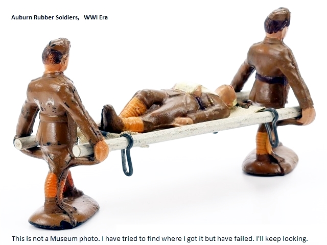 This picture groups two medics carrying a wounded soldier on a stretcher.