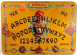 This is a photo of the Gift Craft Swami taking board, I think. Wish I could be certain. It is a colorful depiction of a Genii rising from a magic lamp. Other figures on magic carpets are depicted as well but are most definitely secondary images.