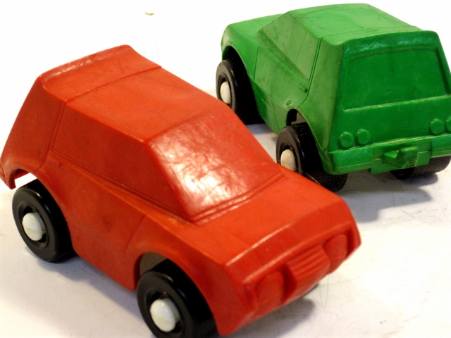 This picture is of two AMC Gremlin-type two door cars, one red and one green. Like most all of the Wee Wheels toys, these have great color, good details, and a vaguely realistic appearance that is designed around sharp angles. There are big, round single headlights incorporated into the grill which, like most of the details, is modesty indeed. The center of the grill is a small four-sided triangle with roll-top desk bars running horizontal across it. Above the grill is a very small hood, very much wider than deep. The hood continues along the side of the car until it fades into the body at the back edge of the door. The wide, short windshield angles sharply back to the top. The back of the car (which is a hatchback) has a spoiler built in at the top edge. There is a large rear window above four round tail lights. Just below them is the rear bumper which has a trailer hitch incorporated into the middle of it. Man. This car is very tough to describe. I wish I could have done better but if you are familiar with the Gremlin you have the best description possible.