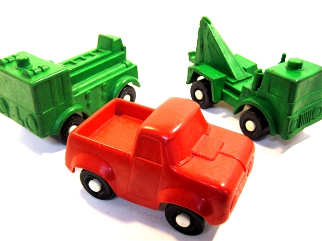 Three trucks, a green fire truck, green tow truck, and a red pickup. All three are cute, no other word works, but irresistable, too. The fire truck is very essentials only, the tow truck looks like just what it says,and the pickup? Bulbous and precious.