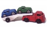 A photo of a red, stamped steel Wyandotte 1930s
				 dump truck about ten inches long